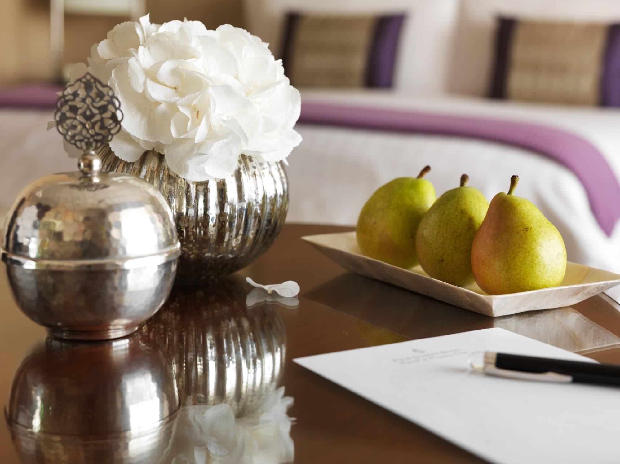 Four Seasons Hotel Riyadh Exterior photo A table with a pen and paper