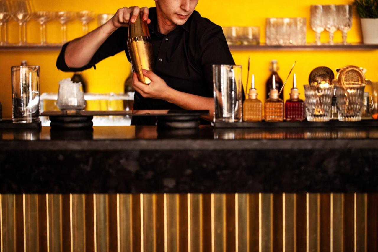 Four Seasons Hotel Riyadh Exterior photo A bartender mixing a drink